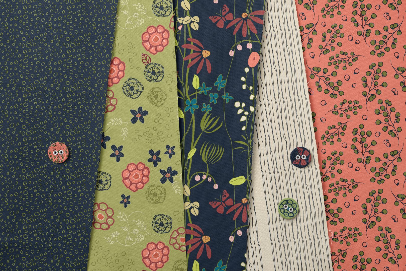 Nature's Tapestry Navy Collection on flat lay with buttons